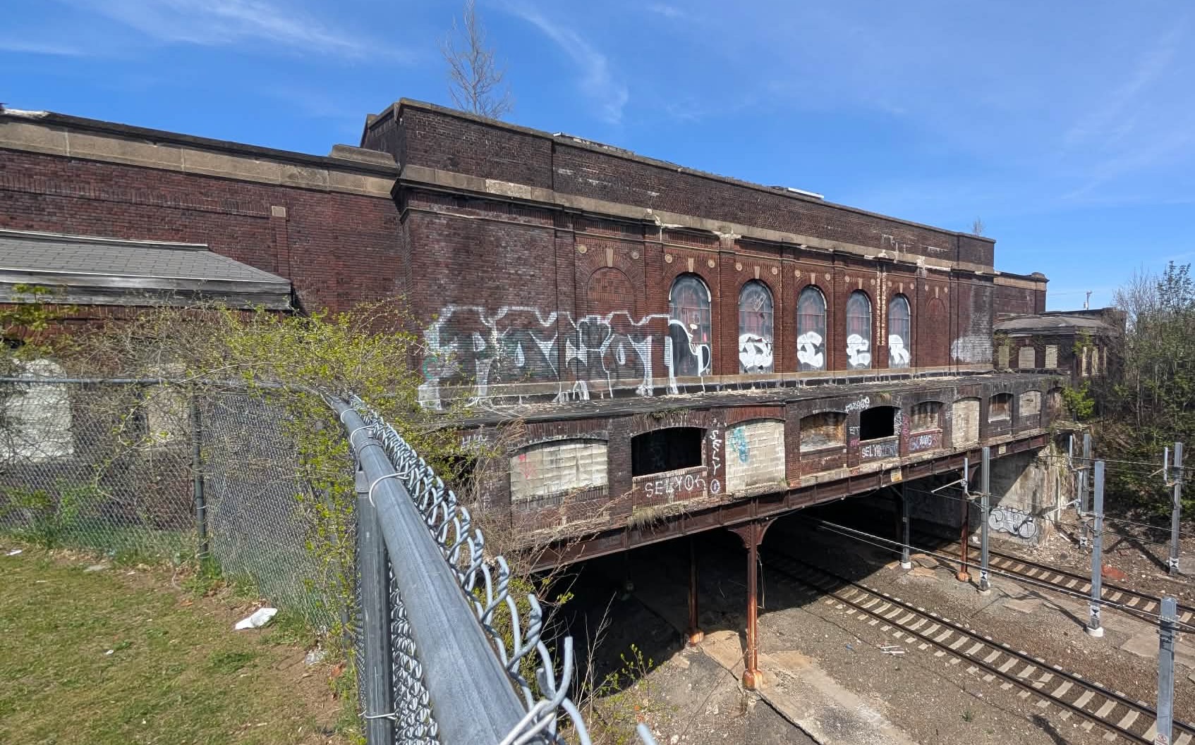 The old train station looming above active train tracks at the Pawtucket/Central Falls city line remains an expensive albatross.