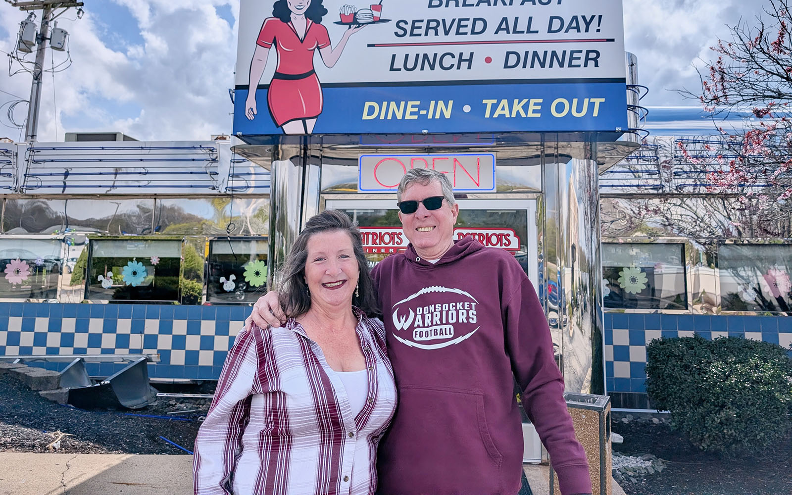 Sandy Boucher and Marc Berthelette stand outside of Patriots Diner in Woonsocket.