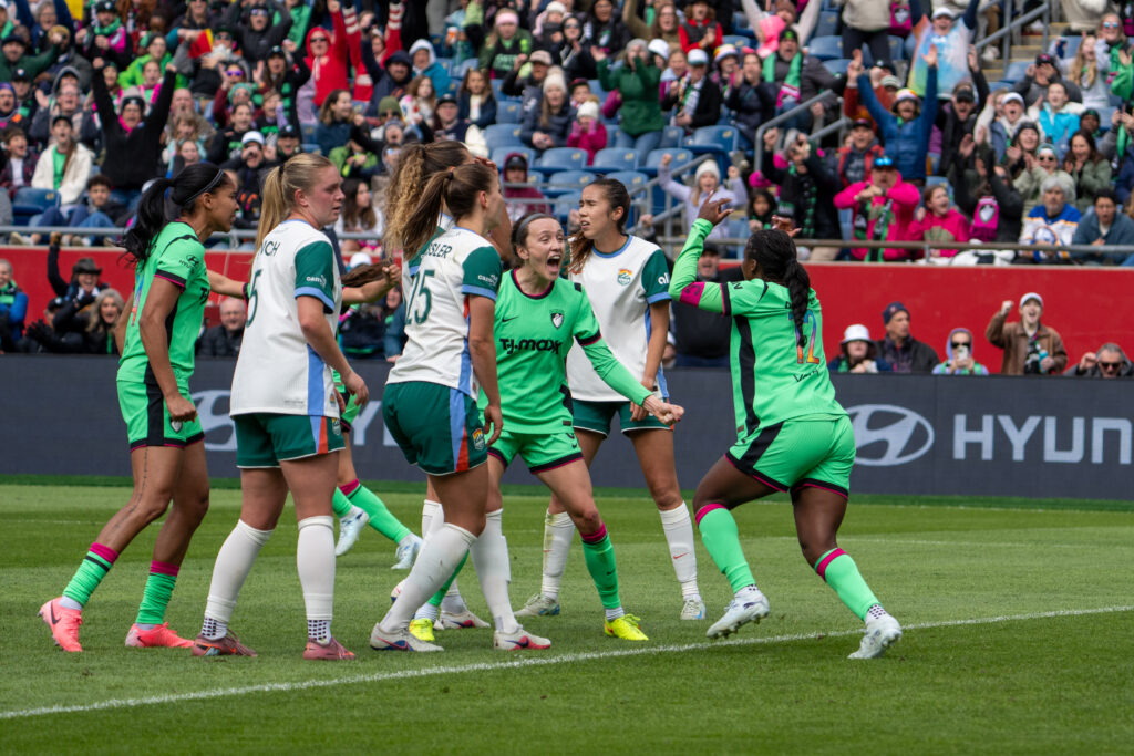 Players react to a goal.