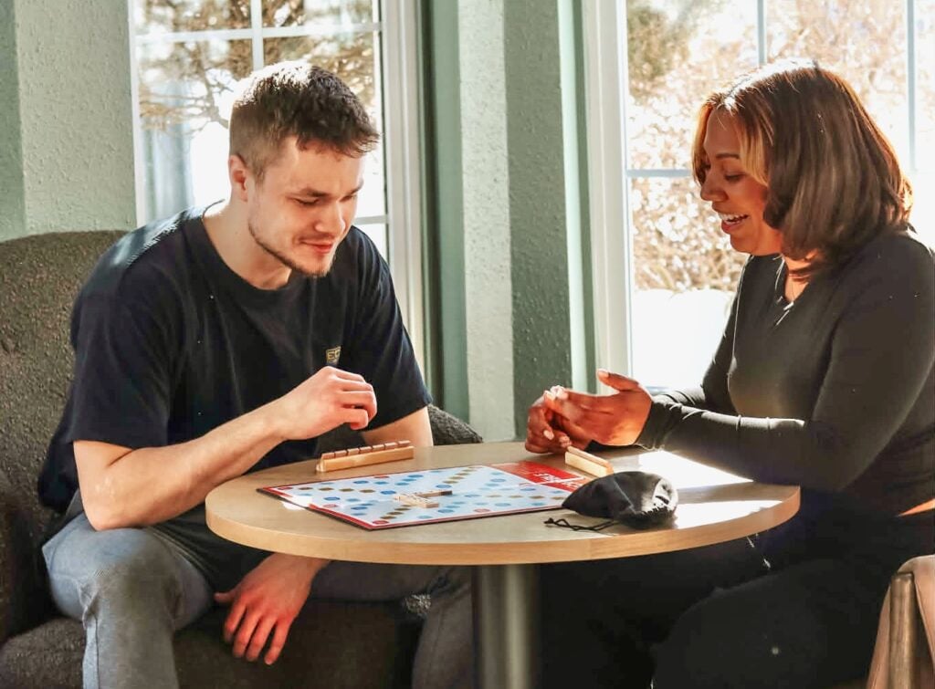 Bogner and Sanchez play a game of Scrabble.