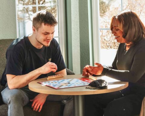 Bogner and Sanchez play a game of Scrabble.