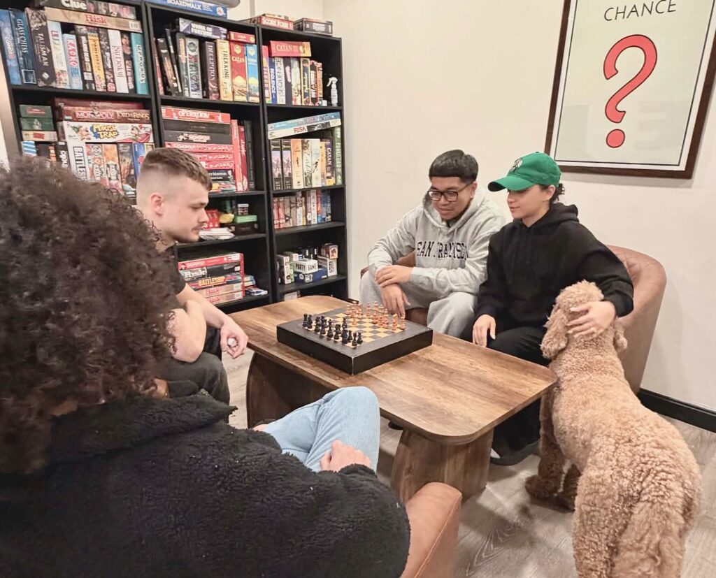 A group plays some chess.