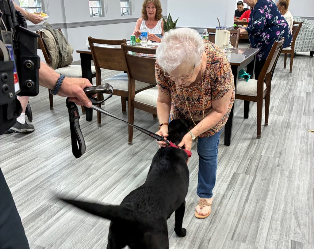 Hope greets a resident.