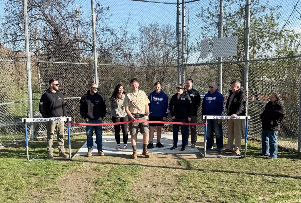 Webber cuts the ribbon on his Eagle Scout project.