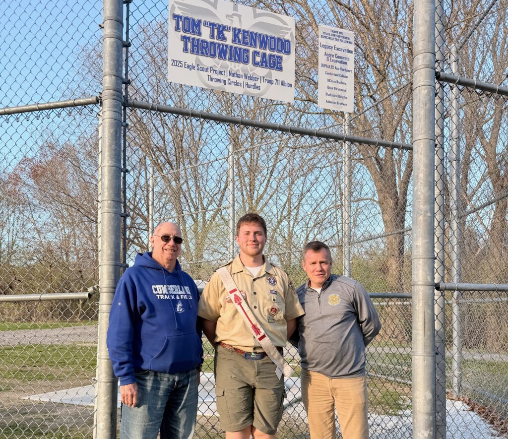 Webber, center, with Tom Kenwood, left, and Parks and Recreation Director Mike Crawley.