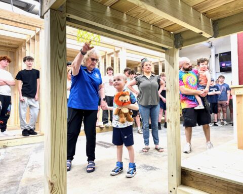Luca Brazil-Sheehan sees the new playhouse built by BHS students.
