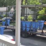 Workers collect bins in the Monastery Heights neighborhood.