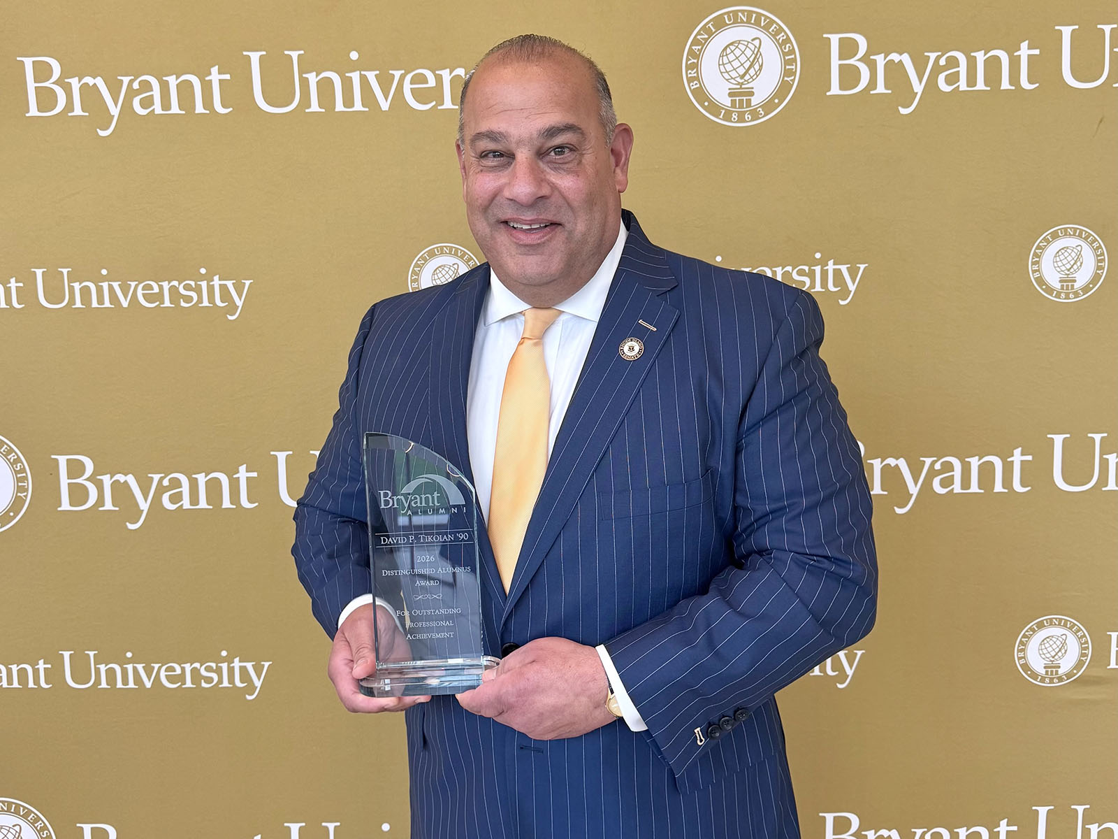 Bryant honors Tikoian and others with Distinguished Alumni Achievement Award