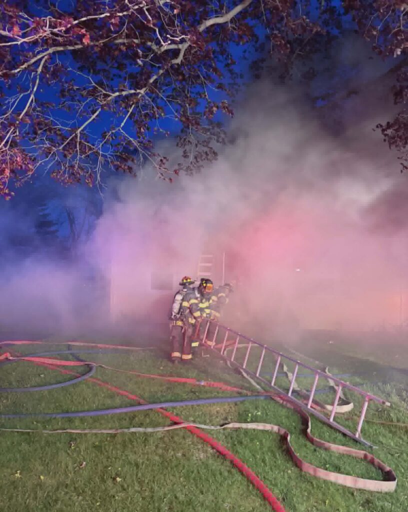 Firefighters battle a fire at a home on Garvin Street Monday evening.