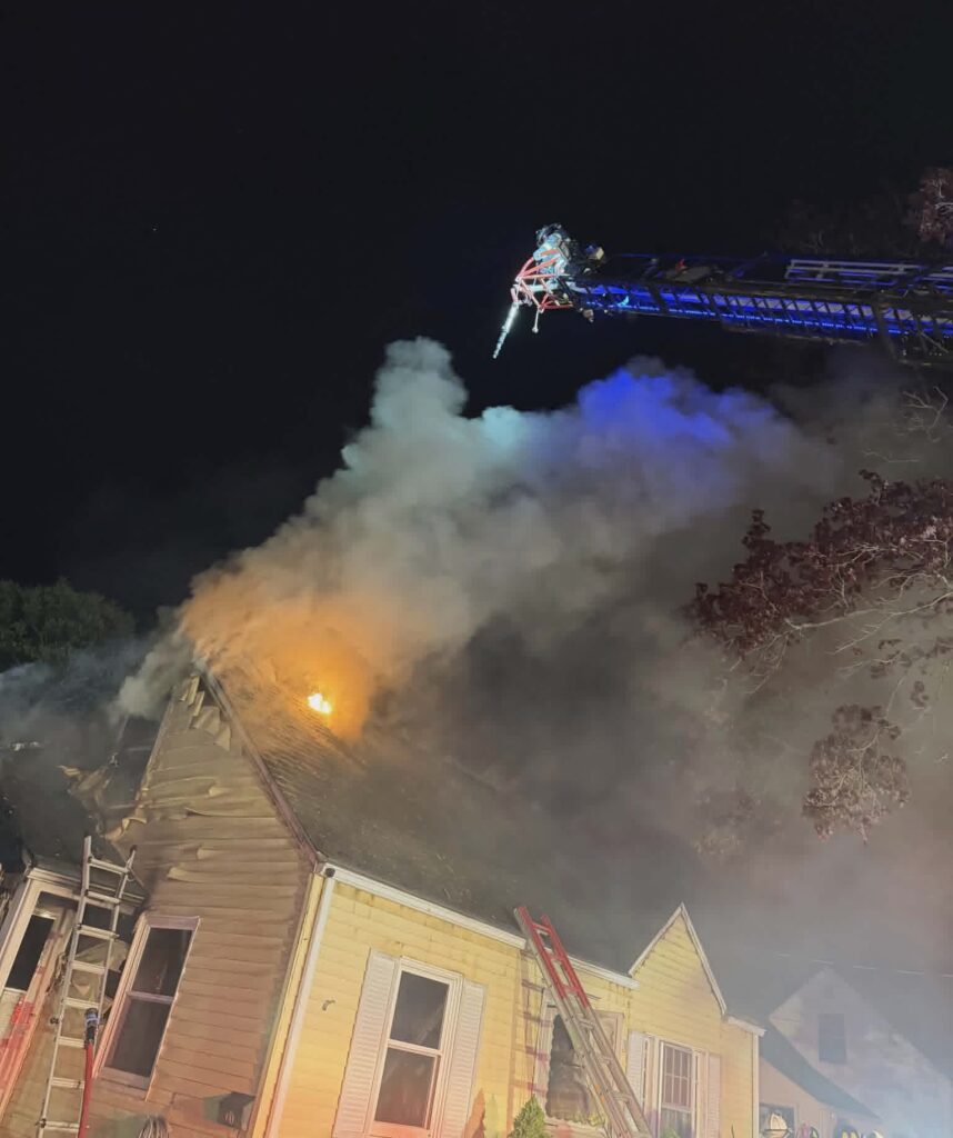 Firefighters battle a fire at a home on Garvin Street Monday evening.