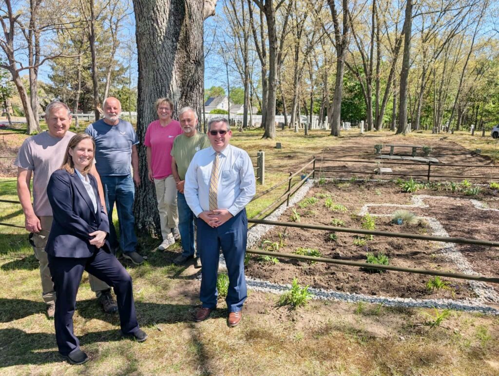 Those behind the new scattering garden at Hotchkiss Cemetery in North Smithfield took a break from their work on Tuesday. Pictured are, clockwise from bottom left, Amy Noble, Richard Keene, Steve Biron, Liane Jalette, Ed Walker, and Chris Todd. (photos by Ethan Shorey)