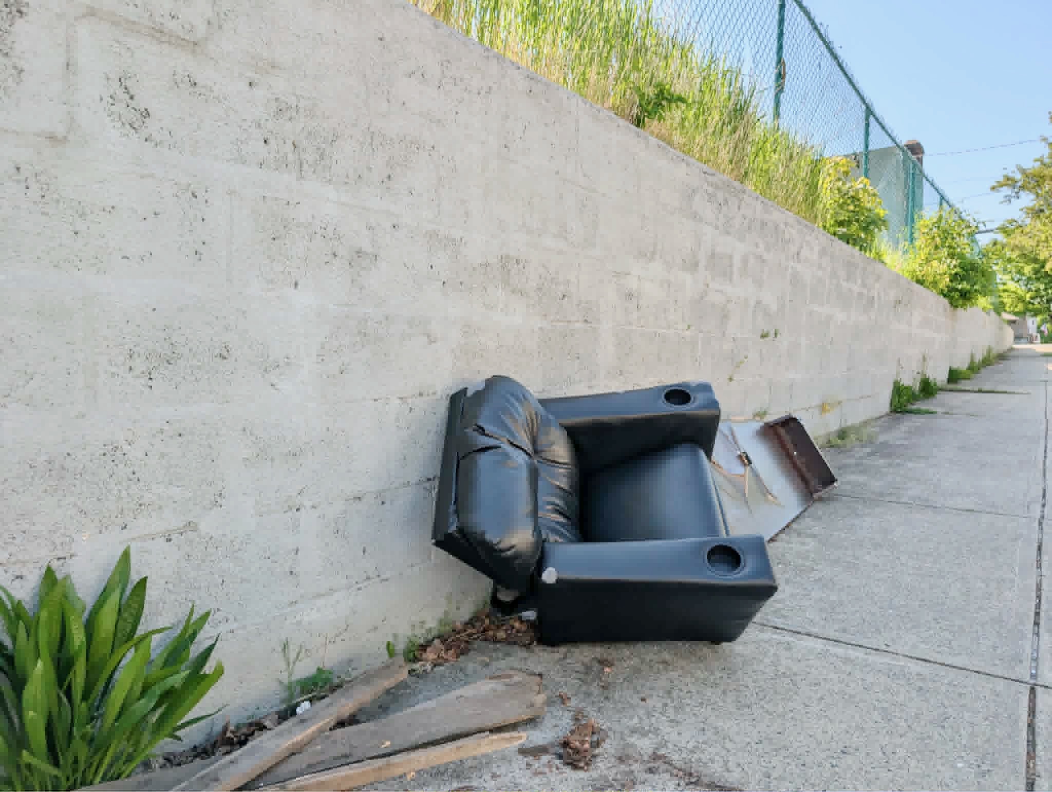 Officials are citing this property at 31 Utton Ave. for overgrown grass and debris left on the sidewalk. (Insider photo by Ethan Shorey)