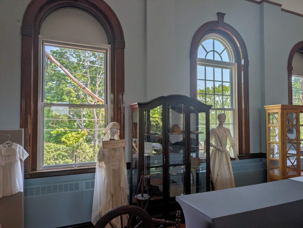 One of the new windows being installed at the Memorial Town Building is seen at right. They're replacing the lesser replacement windows seen at left.