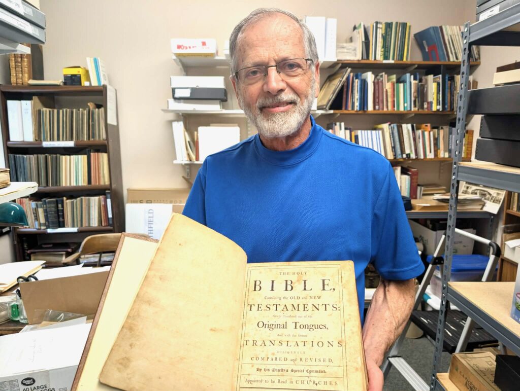 Menard shows the inside pages of the Bible.