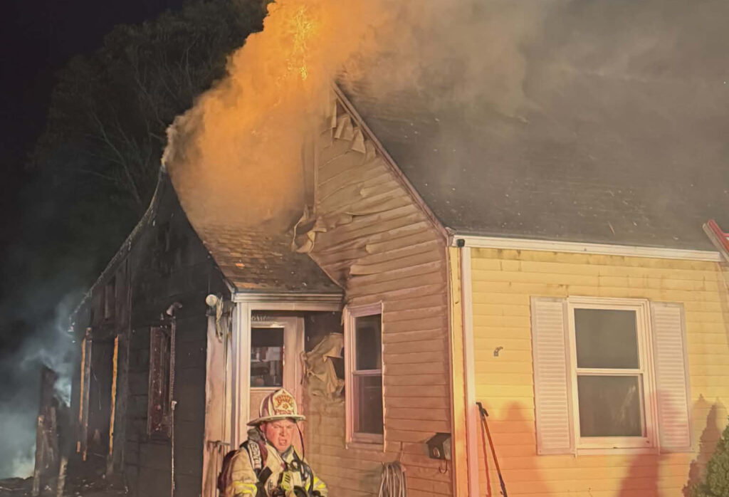Firefighters battle a fire at a home on Garvin Street Monday evening.