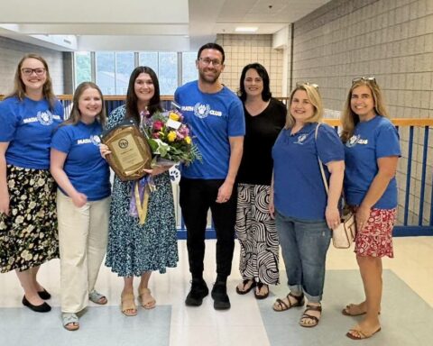 NPHS Teacher of the Year Kathleen Cullen poses with some of her fellow teachers at the school.
