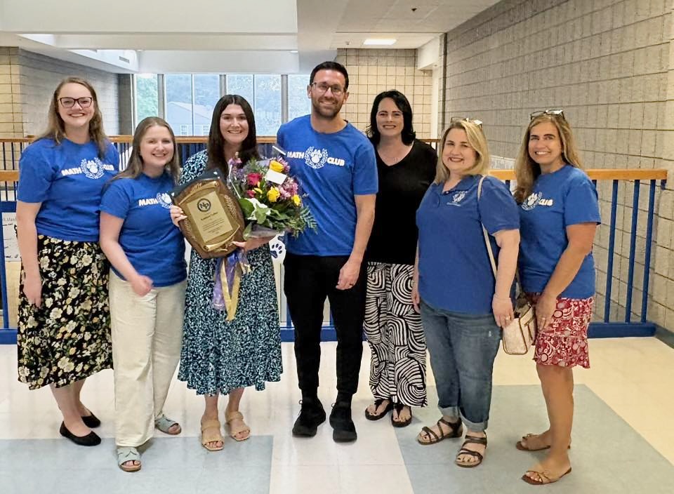 NPHS Teacher of the Year Kathleen Cullen poses with some of her fellow teachers at the school.