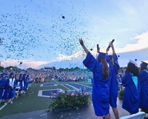 Cumberland High School graduates celebrate their achievement on Friday evening at Tucker Field.