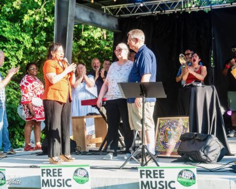 Valerie Gonzalez presents Dave Richards with his honor Friday evening. (photos by Paul Alan White)