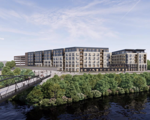The rendering view of the pedestrian bridge and residential complex at Tidewater Landing.
