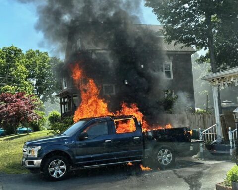 The truck in flames.