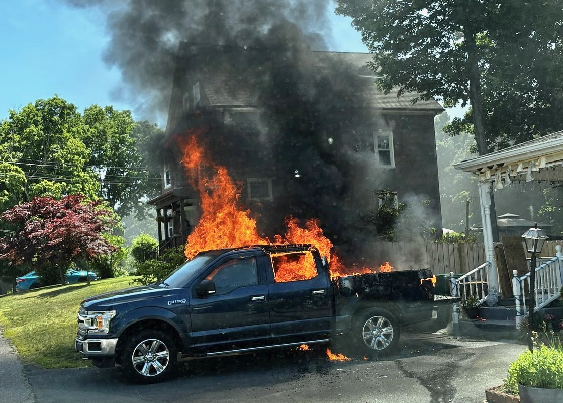 The truck in flames.