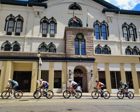 Racers pass Woonsocket City Hall on Sunday.