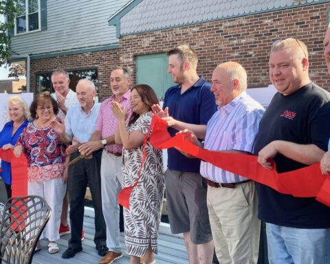 Officials line up to cut the ribbon on the official opening.