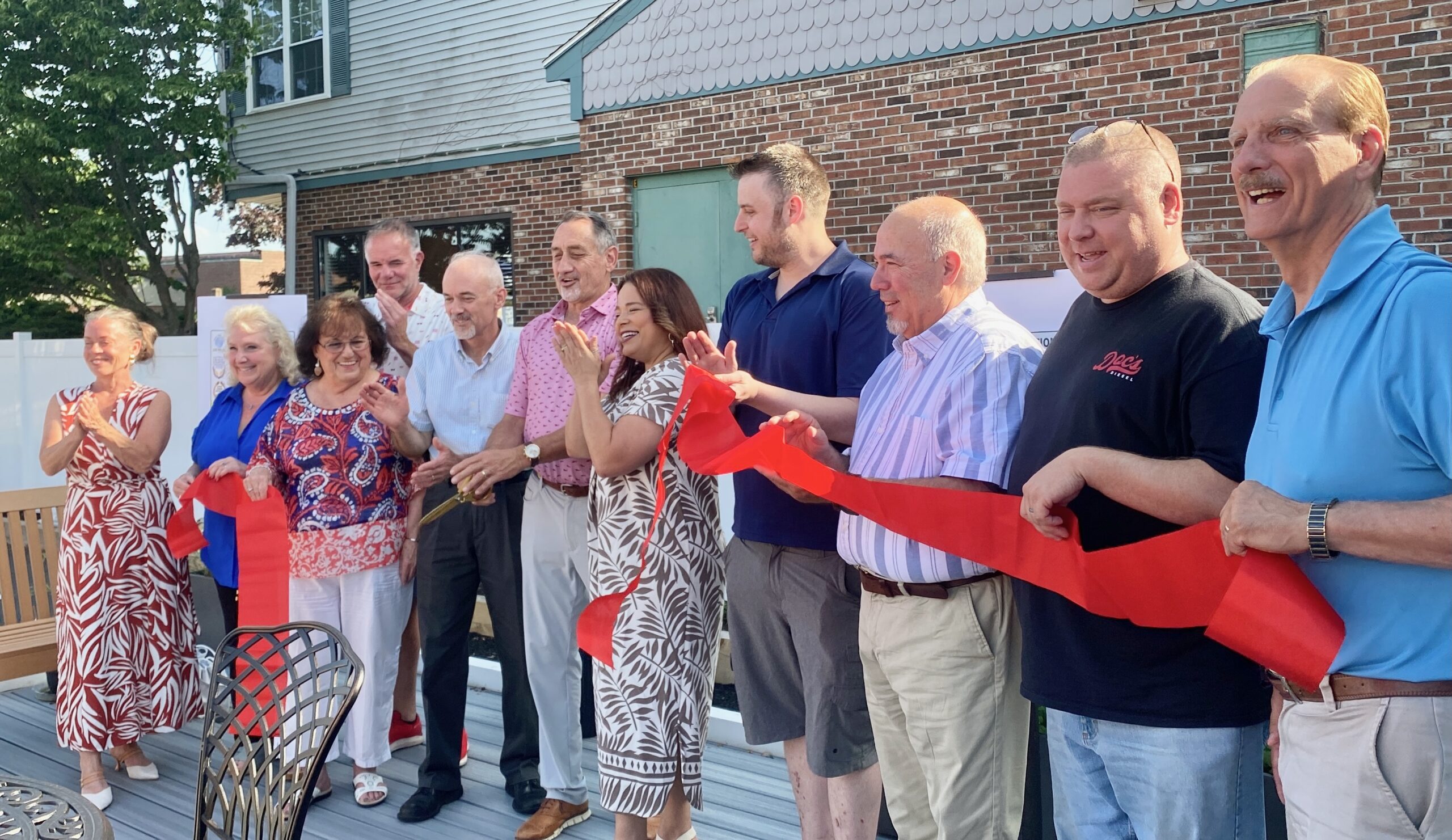 Officials line up to cut the ribbon on the official opening.