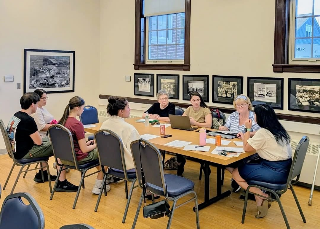 Committee members meet on July 13.