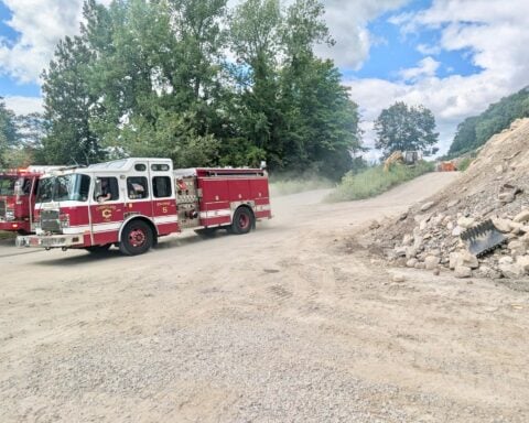 A Cumberland Fire crew leaves the scene of the overturned dump truck at the quarry on Tuesday.