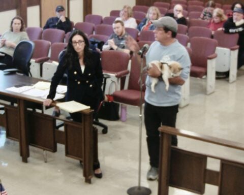 Puppy on his arm and attorney Joelle Rocha by his side, developer John Somyk explains his reasoning for the project he proposed in Lincoln.