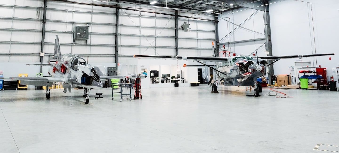 Merlin's Cessna 208 Caravan and L-39 Albatros at the North Central State Airport hangar.