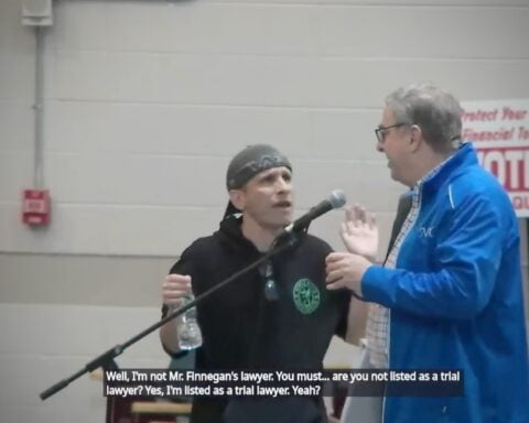 Chuck Collins gets in Mike Marcello's face during the most recent Scituate Town Council meeting. Feuds in town are just as much about party lines as they are about local actions.