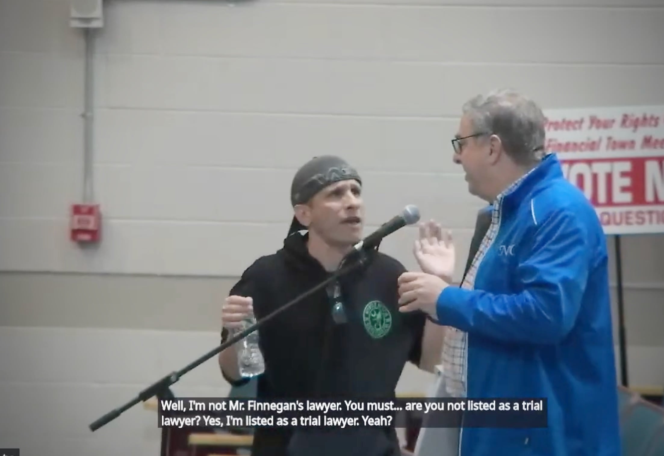 Chuck Collins gets in Mike Marcello's face during the most recent Scituate Town Council meeting. Feuds in town are just as much about party lines as they are about local actions.