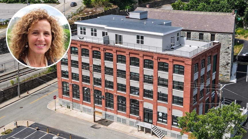 Former Mayor Lisa Baldelli-Hunt and the luxury apartment building at 43 Railroad St. in Woonsocket.